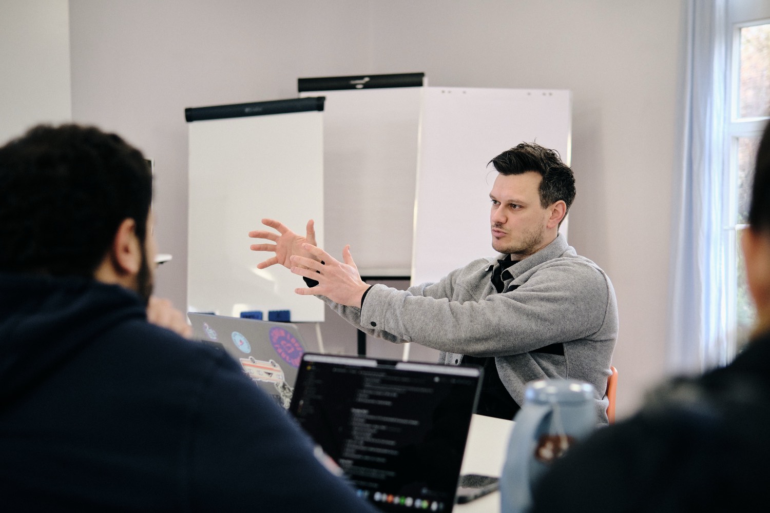 Raphael Jung explaining an idea to the team at an offsite